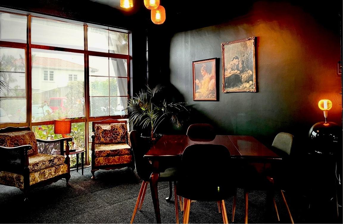 A dining table beside the window in Lumen by Lustre